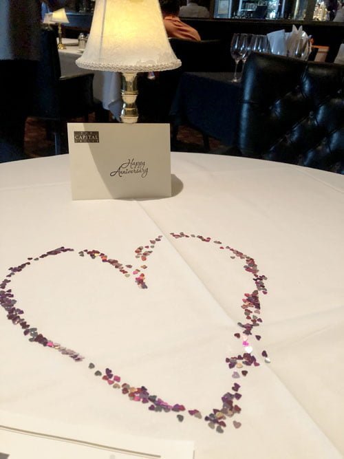 Heart shaped confetti on our table for our anniversary dinner. Romantic Dinner at the Capital Grille in Boca Raton