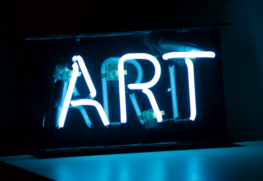 neon sign that reads ART